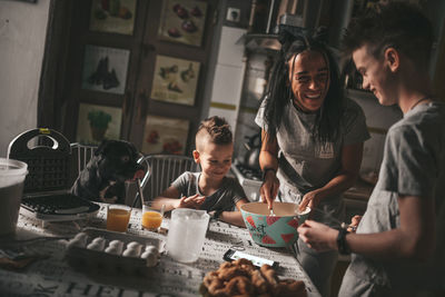 Young couple sitting on table at home