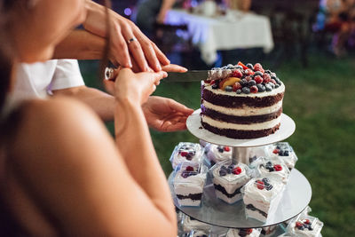 Midsection of woman with ice cream