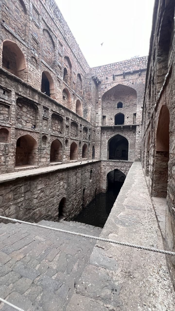 architecture, built structure, arch, history, the past, travel destinations, ancient history, building exterior, ancient, travel, wall, tourism, nature, day, sky, amphitheatre, no people, city, ruins, outdoors, old ruin, old, temple, amphitheater, fortification