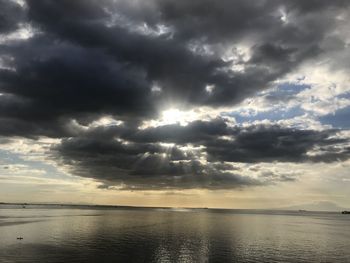 Scenic view of sea against cloudy sky