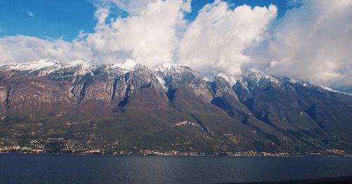 Scenic view of mountains against cloudy sky