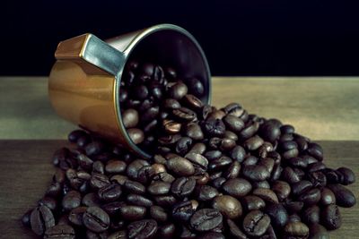 Close-up of coffee beans on table