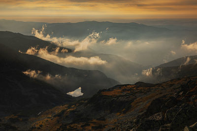 Scenic view of mountains against sky during sunset