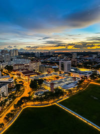 High angle view of city street and buildings against sky