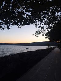 Scenic view of sea against clear sky during sunset