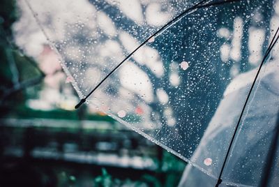 Close-up of wet glass window in rainy season