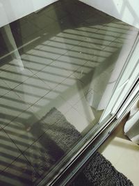 High angle view of glass window on floor at home