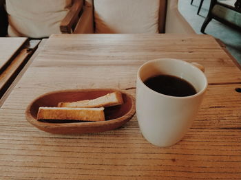 Close-up of coffee cup on table