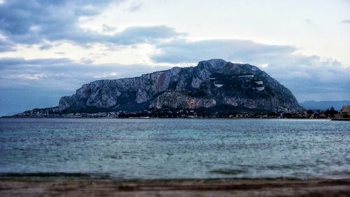 Scenic view of sea against cloudy sky