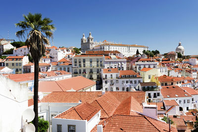 Residential buildings against blue sky