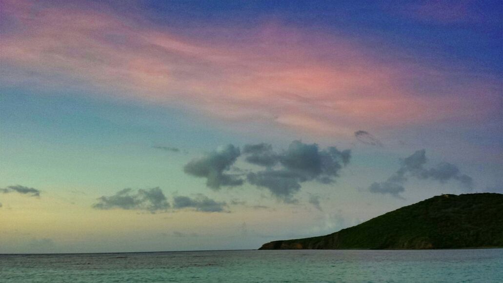 sea, tranquil scene, water, scenics, tranquility, sky, beauty in nature, waterfront, horizon over water, nature, cloud - sky, idyllic, cloud, sunset, cloudy, outdoors, remote, non-urban scene, calm, mountain