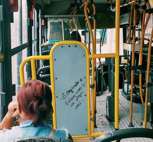 Rear view portrait of woman on bus