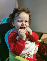 Cute baby girl sitting at home