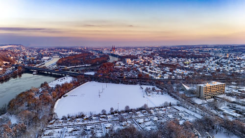 High angle view of city against sky during sunset