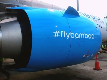 Close-up of airplane on airport runway