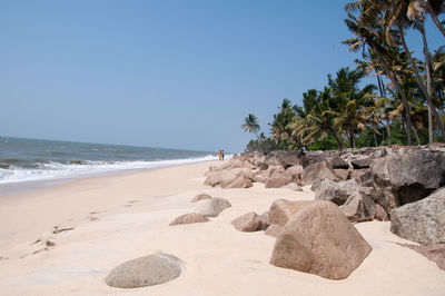 Scenic view of beach against clear sky