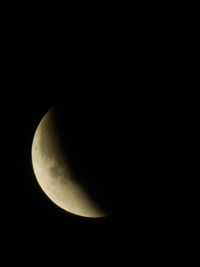 Low angle view of moon against sky at night