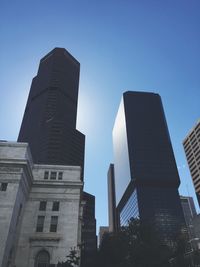 Low angle view of modern skyscraper against clear sky
