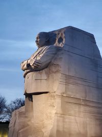 Low angle view of statue against sky