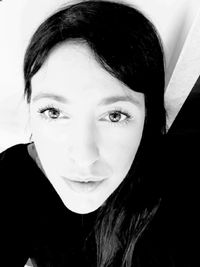 Close-up portrait of young woman at home