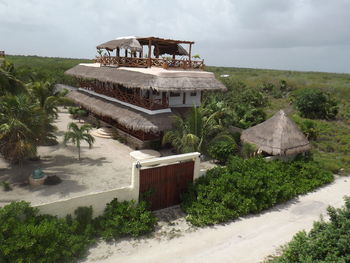 Built structure on beach against sky