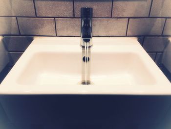 Close-up of faucet in bathroom