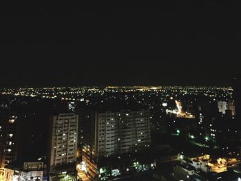 Illuminated cityscape at night