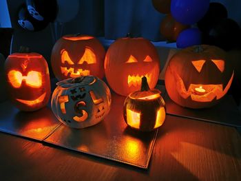 View of illuminated pumpkins on table