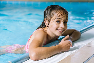 Portrait of happy boy in swimming pool