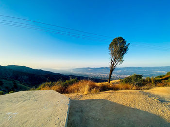 Scenic view of landscape against clear blue sky