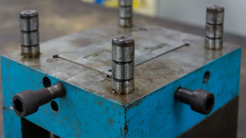 Close-up of blue equipment on table