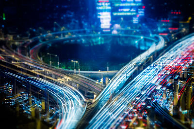 High angle view of light trails on road at night