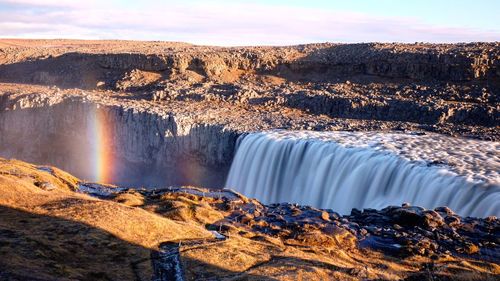 View of waterfall against the sky