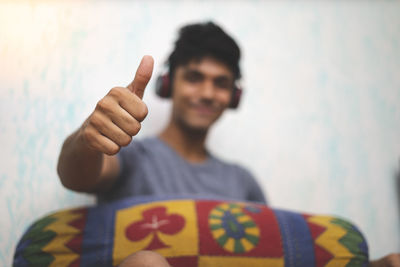 Portrait of young man holding camera