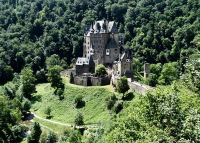 High angle view of historic building amidst trees