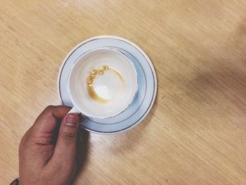 High angle view of coffee cup on table