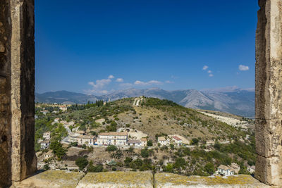 Scenic view of mountains against blue sky