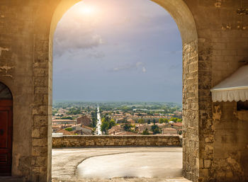 Buildings seen through arch window