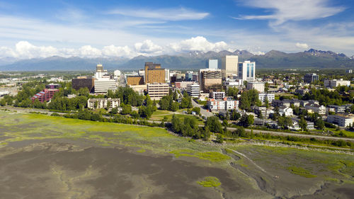 Buildings in city against sky