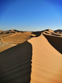 Scenic view of desert against clear sky