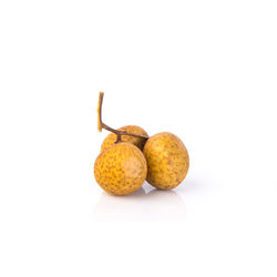 Close-up of oranges against white background