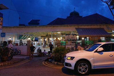 Cars on illuminated city at night