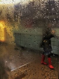 Close-up of wet glass window in rainy season