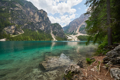 Scenic view of lake and mountains against sky