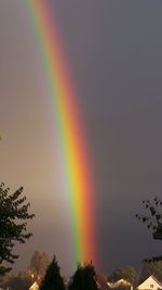 Low angle view of rainbow against sky
