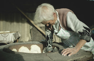 Full length of man preparing food