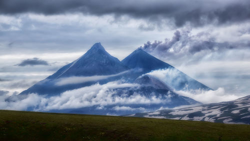 Scenic view of snowcapped mountains against sky