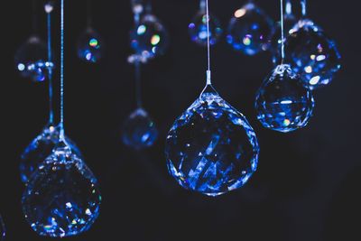 Close-up of decorations hanging in darkroom