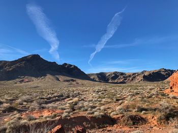 Panoramic view of landscape against blue sky