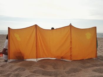 View of tent on beach against sky